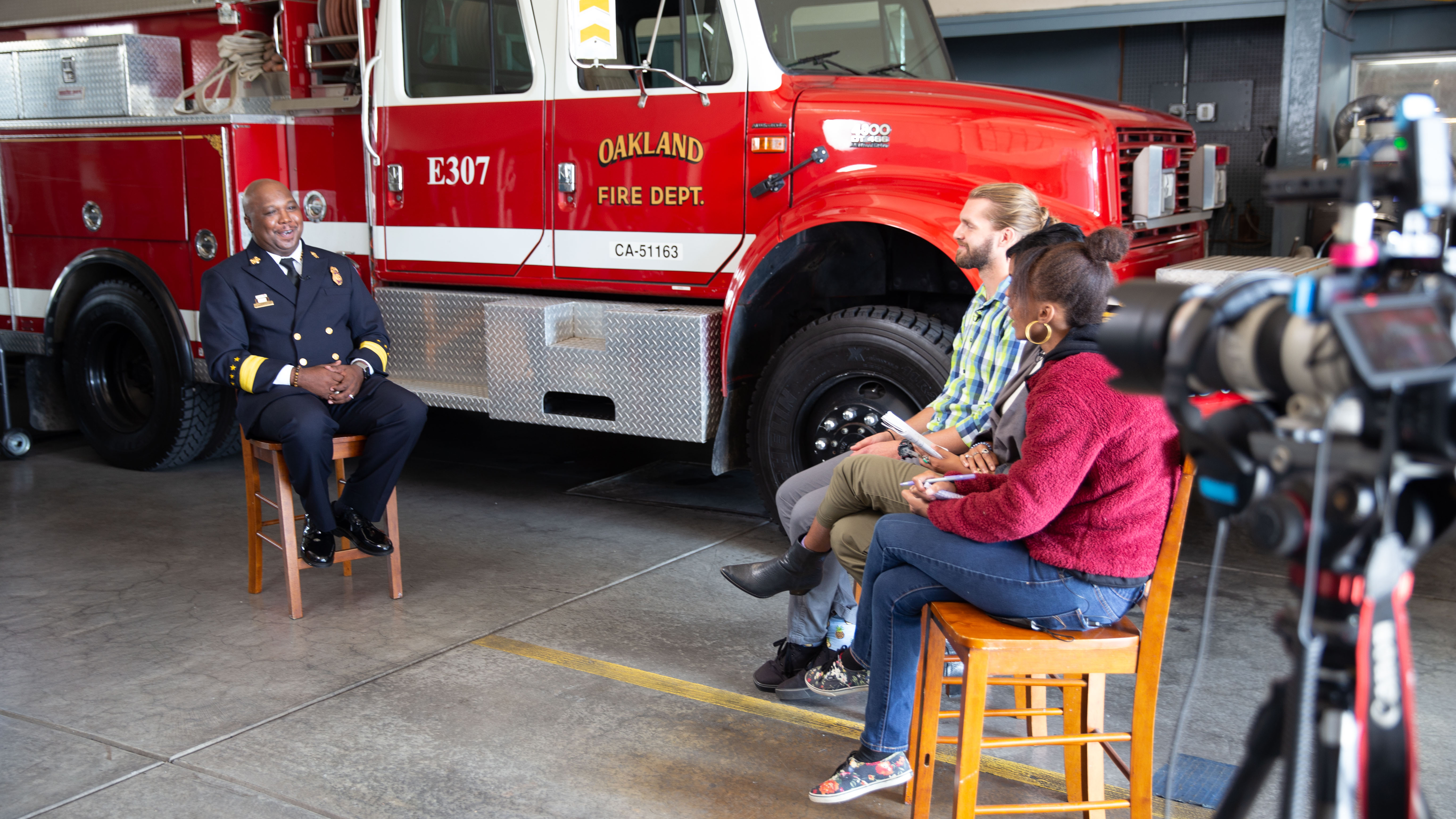 First from left, Oakland fire chief Reginald Freeman engages with the roadtrippers about how to find a personally fulfilling career that serves the public good.